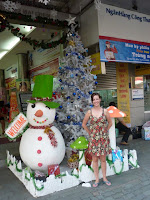 Lynette admiring the local decorations, particularly amusing when 99.99% of the locals certainly haven't actually seen a snowman in the, erm, snow.