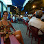 Enjoying a quick beer in the ever so miniature plastic chairs in the street...