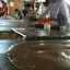 Melted down coconut sweets, immensely tasty, and this is their production line.