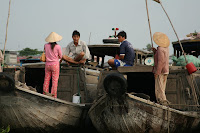 Catching up on gossip? Courting? Who knows, but pyjamas certainly know no boundaries in Vietnam...