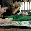 Finer embroidery on a painting scale.