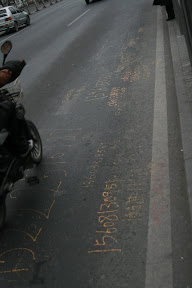 A strange set of numbers scrawled across the road; Lynette says this is quite a boring photo... she's probably right!