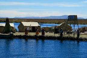 Inhabitants rush to the island's edge to encourage us to dock.