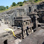 Difficult to get the sense of size and scope here, but you are looking at the top of the temple in the middle as it drops down into its carved out home.