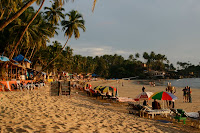 Sitting at a table on the beach, looking left. We were quite busy in Goa.