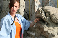 Lynette pondering how to remove the spherical stone from the Lion's mouth and therefore gaining immortality.