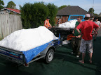 A truck and trailer load back at the flat