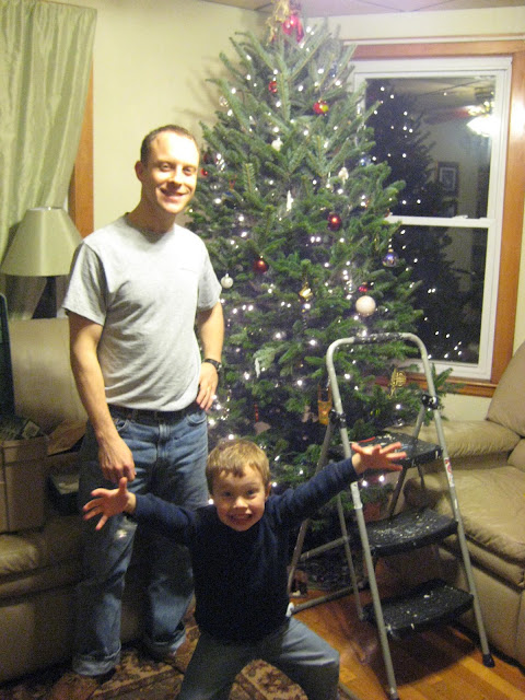 Victorious Christmas tree assemblers