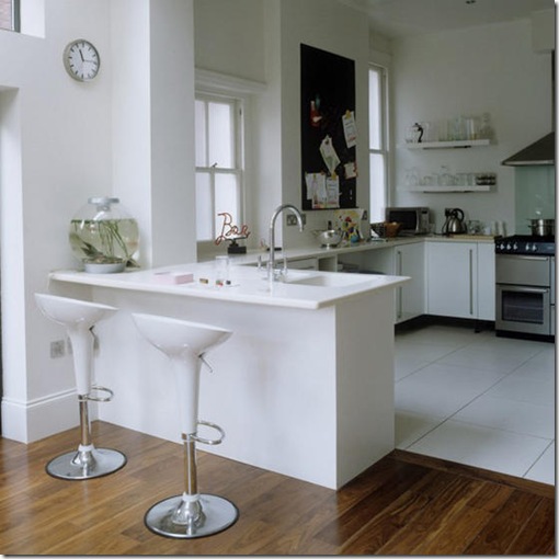 White open plan kitchen dining area breakfast bar unit stools combined wood ceramic flooring L etc 02/2007 not used real home