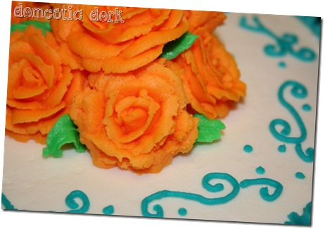 orange Wilton cake decorating class rose