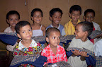 The children receiving their first ever school uniforms.