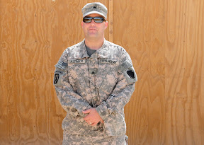 Sgt. William Altman, an operations noncommissioned officer for 28th Combat Aviation Brigade and resident of Pittsburgh, Pa., stands outside the 28th Combat Aviation Brigade tactical operations center. Altman has logged seven deployments during his 18 years in the military. (U.S. Army photo by Sgt. 1st Class Dale Shade)