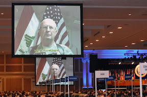 Live via satellite from Iraq on Sept. 12, 2009, Maj. Gen. Richard Nash, commander, 34th Infantry Division, tells attendees at the 131st National Guard Association of the United States General Conference in Nashville, Tenn., about the contributions of National Guard Citizen-Soldiers and -Airmen to the warfight. (U.S. Army photo by Staff Sgt. Jim Greenhill) (Released)