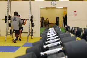 During a workout, a Soldier receives help and motivation from a buddy. Soldiers that participate in the Red Bull Goal Achievement Challenge will receive coaching and tips on how to set and achieve goals, as well as how to improve their resiliency. This enables them better deal with difficult situations they may encounter here or back home. (U.S. Army photo by Spc. Darryl L. Montgomery)