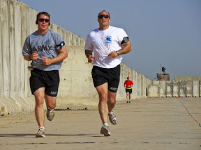 Capt. Kenneth Evans and 1st Lt. Andrey Postrigan, 5th Battalion, 82nd Field Artillery Regiment, 4th Brigade Combat Team, 1st Cavalry Division, run the “Mighty Maysan Marathon” on Forward Operating Base Hunter recently.