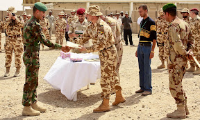 New Iraqi Army commandos graduate from a Romanian-led course at Camp Dhi Qar May 23. (U.S. Army photo by Spc. Creighton Holub)