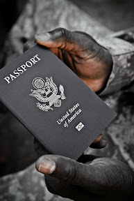 A Soldier who received citizenship through naturalization holds his passport. The only place Soldiers can apply for a passport in Iraq is the United States Embassy located in the International Zone in Baghdad, according to Capt. Catherine Laroque, 34th Infantry Division, chief of legal assistance. Work is being done to get a passport agency located in Basra. (U.S. Army photo by Pfc. Tyler Maulding)