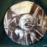 Cultural Lag , K.M. Newton, 2003  Medium: Charcoal   Dimensions: 30 inches by 30 inches   Statement: "Cultural lag" indicates the failure of a society to keep up with technological and environmental changes in its economic, social, legal, and political policies. We are but children drowning in a world of our own design.   Showings & Awards:  Awarded "1st in Drawing" September 21, 2003 - Juried Student Art Exhibition Juried by Chicory Miles and Walter Johnson Nomad Gallery – Hammond , LA