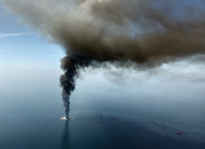 An aerial photo shows oil in the Gulf of Mexico, more than 50 miles southeast of Venice on Louisiana's tip, as the Deepwater Horizon oil rig burns. The deepwater oil platform that burned for more than day after a massive explosion sank into the Gulf of Mexico on Thursday, April 22, 2010, turning what is likely a deadly blast into an environmental emergency. (AP Photo / Gerald Herbert)