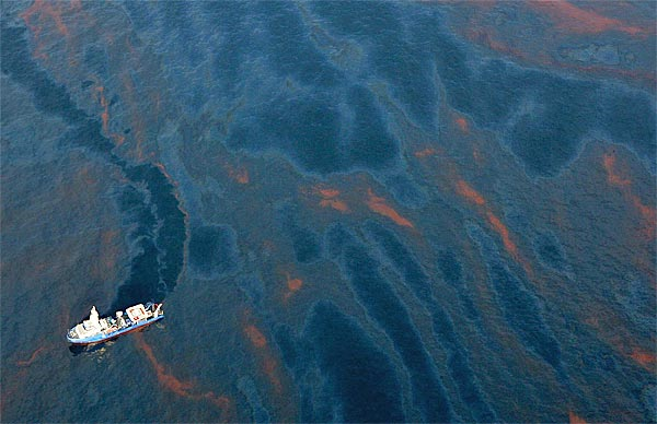 A ship traverses the BP Gulf oil spill. latimes.com