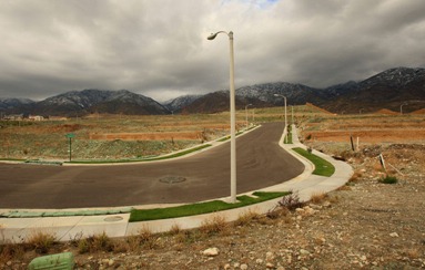 Storm clouds hover near unfinished home lots during a break between storms after the dwindling new home sales market brought construction to a halt at a new home development December 16, 2008 in Rancho Cucamonga, California. Home construction took its biggest dive in 24 years in November to reach a record low. (David McNew/Getty Images)