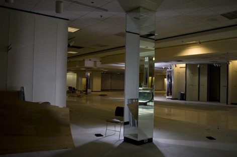 As the recession alters American spending habits, traditional shopping malls like Eastland Mall, in Charlotte, NC, are deterioriating into nearly vacant 'dead malls' at an accelerating pace. Glimcher Realty Trust, the Columbus, Ohio-based owner of 23 malls and the sole-owner of Eastland, wants to divest the mall rather than spend the hefty sum needed to redevelop it, and enlisted a broker to woo private buyers. Andy McMillan for the Wall Street Journal 