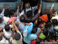 Riders cram into a train last month in New Delhi, India. India's population is expected to be 1.7 billion by 2050.