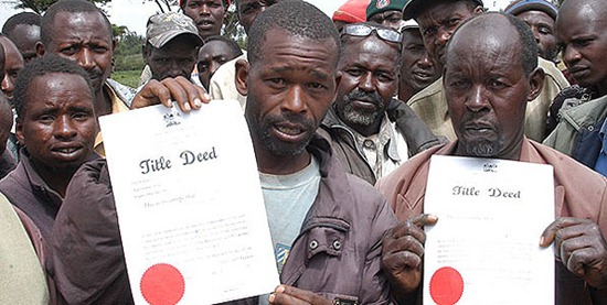 Members of the Ogiek community who live in the Nessuit area of the Mau Forest display title deeds they say were issued to them by the government in the 1990s. Photo: JOSEPH KIHERI and WILLIAM OERI 