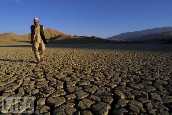 A man walks on the dried, cracked landscape of Hanna Lake October 18, 2001 near Quetta, Pakistan. Once a recreation area for Quetta residents, the lake is now vacant of any business and completely dried up after over three years of drought in Pakistan and neighboring Afghanistan. Photo: Paula Bronstein / Getty Images Oct 18, 2001