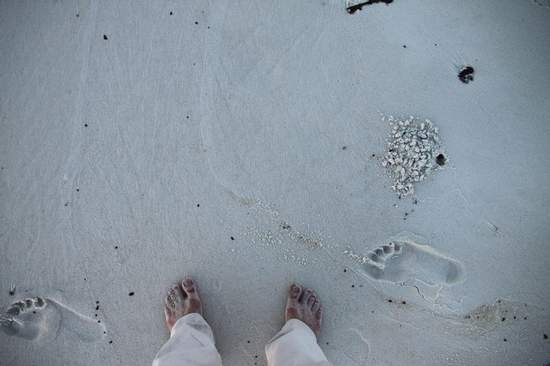 A section of beach across from Peg Leg Pete's that was contaminated with thick tar and oil on Wednesday appeared to have been cleaned by contractors overnight. But Thursday evening a News Journal reporter found much of the oil from the previous day was buried by the high tide Wednesday night and remained just an inches beneath the surface. Travis Griggs / tgriggs@pnj.com