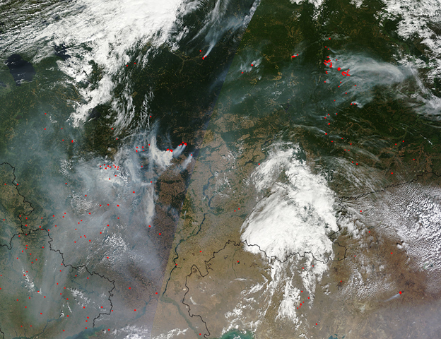 A veil of gray shrouds western Russia as plumes of thick smoke pour from numerous fires blazing in the region on August 15, 2010, when the MODIS aboard the Terra satellite captured true-color images as the satellite passed overhead. In this composite image, the Ukraine lies at the left lower (southwestern) corner. Moscow is obscured by cloud and smoke near the center of the western edge of the image. Jeff Schmaltz, MODIS Land Rapid Response Team, NASA GSFC