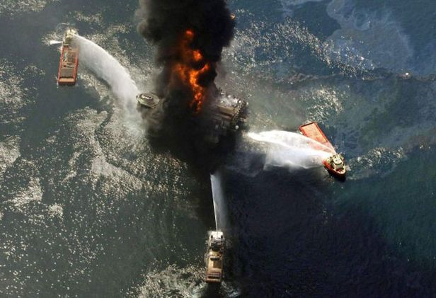 Troubled waters: the Deepwater Horizon aflame on 21 April 2010. The stricken rig sank the following day. AP