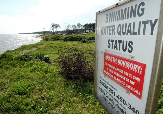 A warning sign advising swimmers to stay out of the Dauphin Island, Ala., waters on June 2, 2010. At least 258 people have gone to local emergency rooms, clinics and urgent care centers since May 14 complaining of ailments thought to be related to the oil spill, Alabama Department of Public Health officials reported today. AP Photo / Jay Reeves