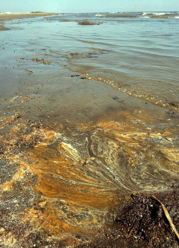 Oil seeps out of a tar patty on the beach between Fourchon and Elmer's Island, Louisiana, Tuesday, September 14, 2010. John McCusker / The Times-Picayune