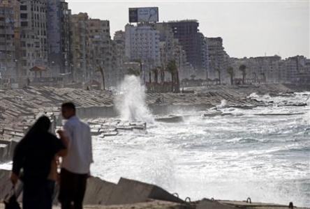A couple walks near the shoreline in Alexandria November 14, 2010. Alexandria, with four million people, is Egypt's second-largest city, an industrial center and a port that handles four-fifths of national trade. Reuters / Goran Tomasevic