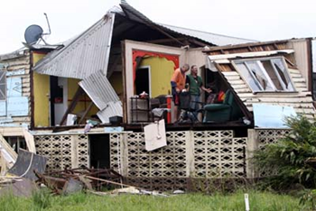 Australian Army personnel help clean up around Townsville after Cyclone Yasi raged through the region. Photographer: Jack Tran &copy; 2011 The Cairns Post PTY LTD.
