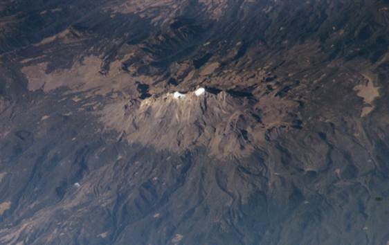 Glacial coverage is seen atop the Iztaccihuatl volcano in this satellite image from 2003. NASA / MSNBC