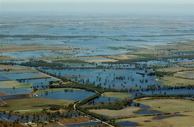 An aerial view of flood water inundating the Wimmera and Southern Mallee region in Victoria, Australia, 12 January 2011. Evacuations have been ordered in several western and north-western Victorian towns as they brace for the worst flooding in over 200 years. Record rainfall has inundated the region and causing several river water levels to rise. Lisa Maree Williams / Getty Images / msnbc.msn.com