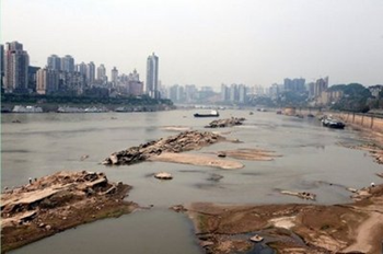 The dried up banks of the Yangtze River in southwest China are seen earlier this month. Chinese factories are facing curbs on electricity use as coal prices soar and a severe drought hits hydropower plants, state media have said, with possible major shortages ahead this summer. AFP / File / Stringer
