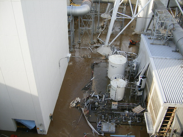 Tsunami wave inundates the Fukushima Daiichi Nuclear Power Station, 11 March 2011. The location is the north side of the Radiation Waste Treatment Facility, at approximately 3:57 PM. TEPCO