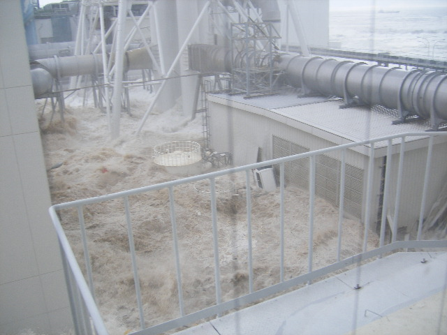Tsunami wave inundates the Fukushima Daiichi Nuclear Power Station, 11 March 2011. The location is the north side of the Radiation Waste Treatment Facility, taken from 4th floor at approximately 3:43 PM. TEPCO
