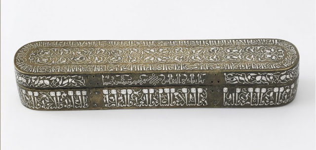Pen boxes were an essential part of a calligrapher's equipment. In addition to containing an ink pot, a pen box would have held several carefully made reed plumes, a pair of scissors, a knife for shaping the plumes, and an assortment of other necessary items. Along the sides of the box an Arabic inscription in animated script is set against a scrolling background of animal heads. Calligrapher: Shazi. Iran. 1210-1211 A.D. 5 x 31.4 cm. Other/unnamed script. Courtesy of the Freer Gallery of Art, Smithsonian Institution.