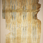he striped textiles of Yemen were famous in medieval times throughout the Islamic world. They were made in the ikat technique, in which the cotton warp threads were bundled together and resist-dyed before being arranged on the loom to form patterns of arrowheads and diamonds. The presence of fringe suggests that this fragment was part of a shawl. Inscriptions on Yemeni ikats are usually either embroidered or, as here, painted. These and other textiles bearing inscriptions were called tiraz, from the Persian word meaning "embroidery." They were produced in tiraz factories, some of which were commercial and others royal.