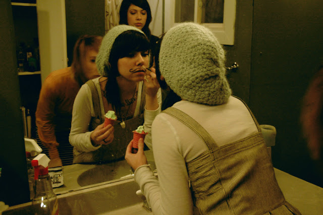 hipster girl drawing on mustache