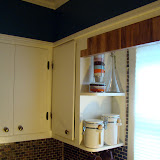 Above the window, I used some scrap pieces of the counter top (from the sink/stove cut outs) to make a valance.