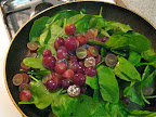 While the steak was in the oven, I used the leftover oil and fat in the skillet to sautee spinach, halved red grapes, a squirt of lemon juice and a sprinkle of nutmeg for a couple of minutes, until the spinach wilted and the grapes were warm. Emerils Red Marble Steaks