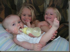 12.6.08 the girls feeding Chloe...lol