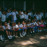 In 1997 several of the trustees and supporters of the Santa Rosa Fund visited Nicaragua and were treated to a display (acto) of folkloric dancing by pupils at the school. This photograph shows some of the pupils (those not performing) lined up waiting to see the acto.