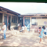 The schoolyard during the holidays in 1988 showing Virginia, the headteacher (who later retired in 2007). Even during the holidays the school served as a focus for community activity.
