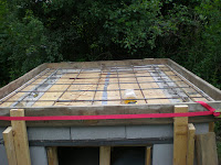 The forms were oiled (including the plywood in the middle) and the white synthetic rope was stapled to the horizontal forms.